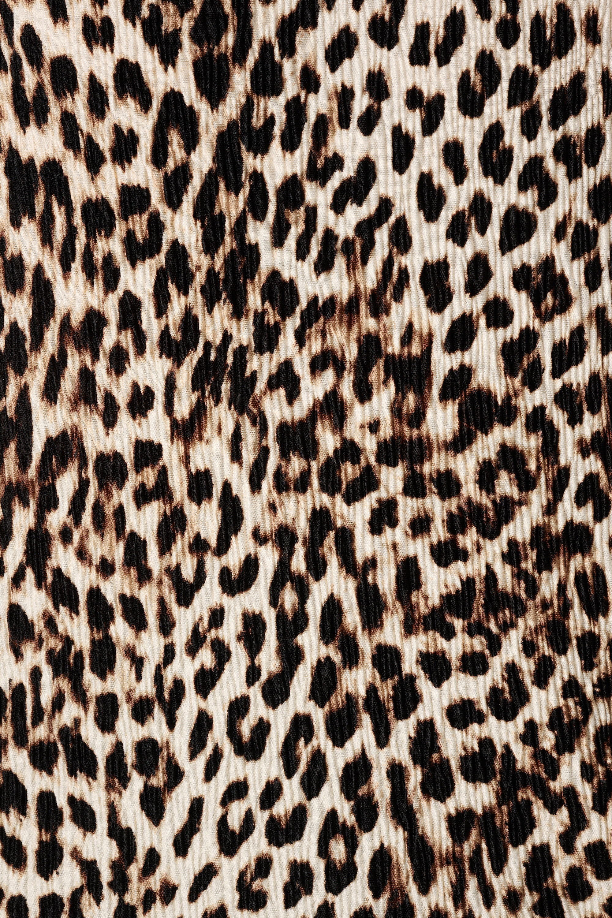 Haut textur&eacute; et mancherons image number 6