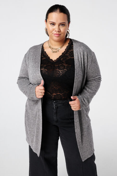 Gilet texturé et un détail pailleté Gilet texturé et un détail pailleté